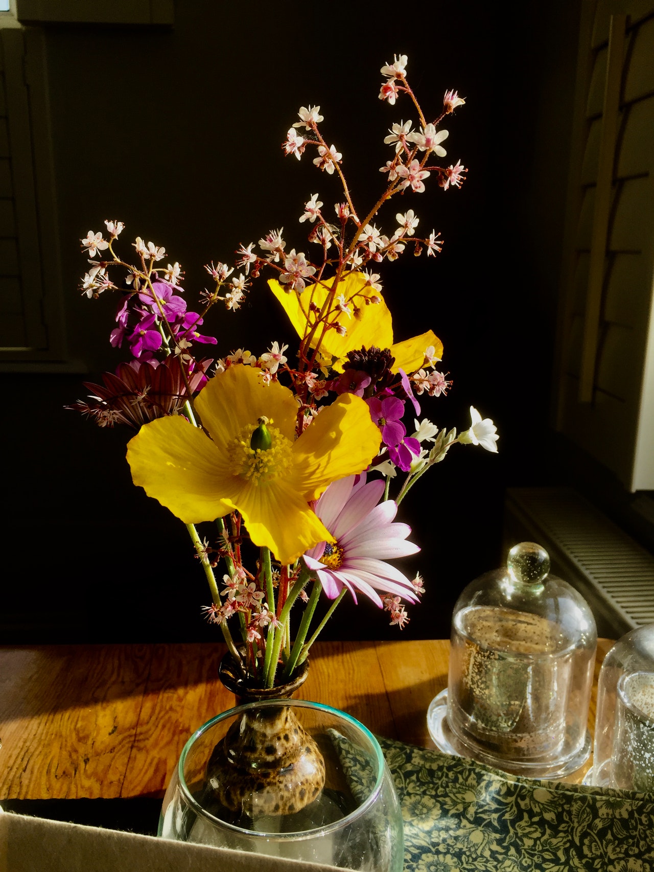 Yellow and Pink flowers in clear glass vase